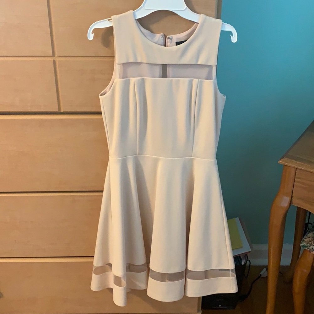 Pale peach/tannish dress.